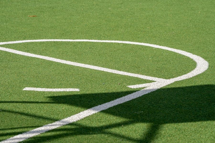 basket-ball-court-with-green-grassy-ground-artificial-grass-and-white-lines_181624-41095.jpg